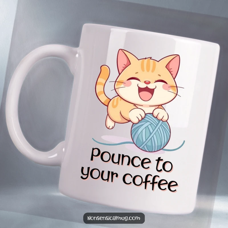 Funny cat mug featuring a mischievous cat character gleefully pouncing on a bouncing ball of yarn, captured in a moment of playful chaos.