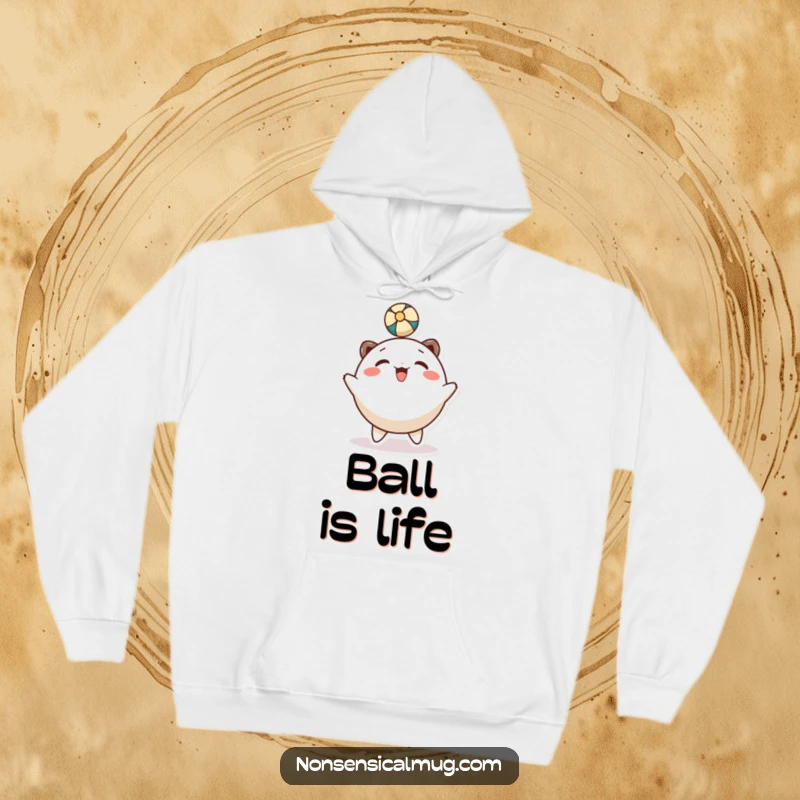 Funny hoodie: a happy, round character is shown gleefully bouncing a ball with its head.