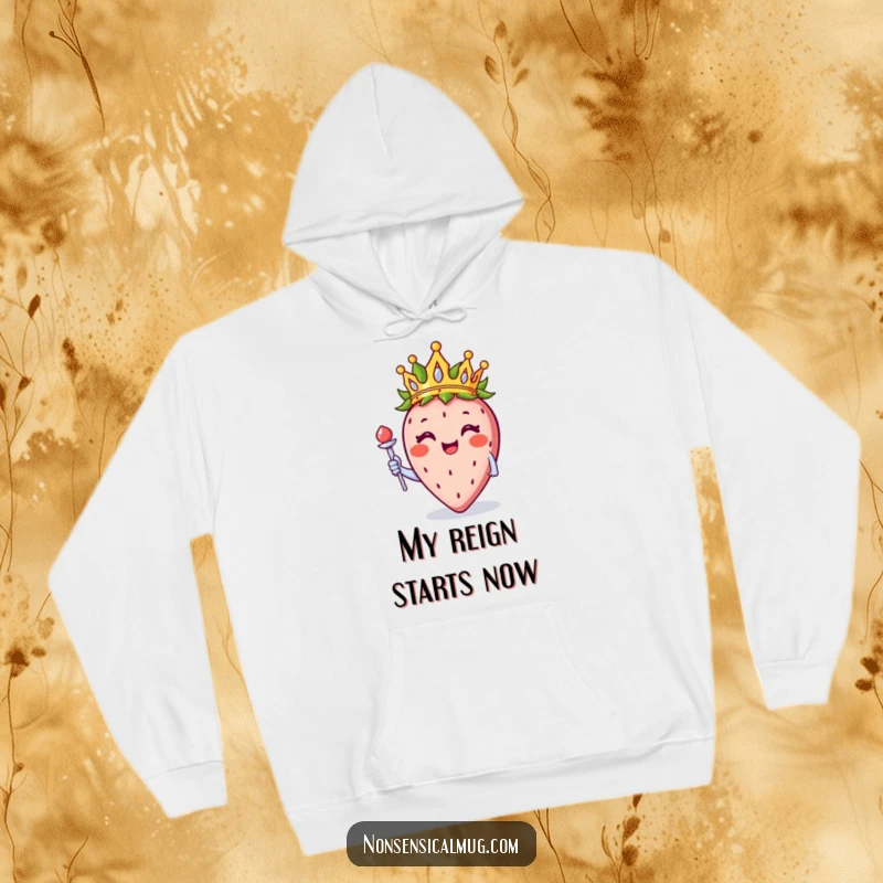 Funny smiling strawberry with a crown and scepter, featured on a warm hoodie for cozy and sweet wear.