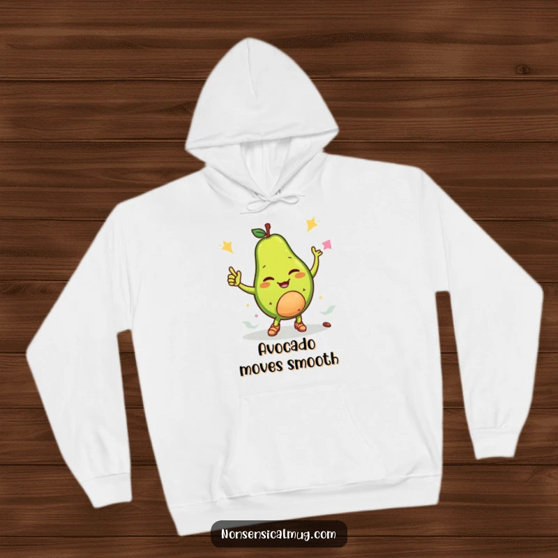 Funny hoodie featuring a winking avocado character breakdancing with its pit, radiating cool vibes and humorous energy.