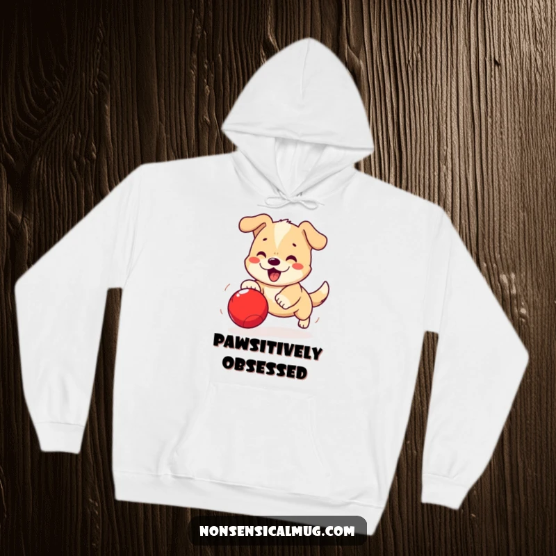 Funny Kawaii Dog Hoodie: A cute kawaii dog is captured mid-chase, excitedly pursuing a bouncing red ball.