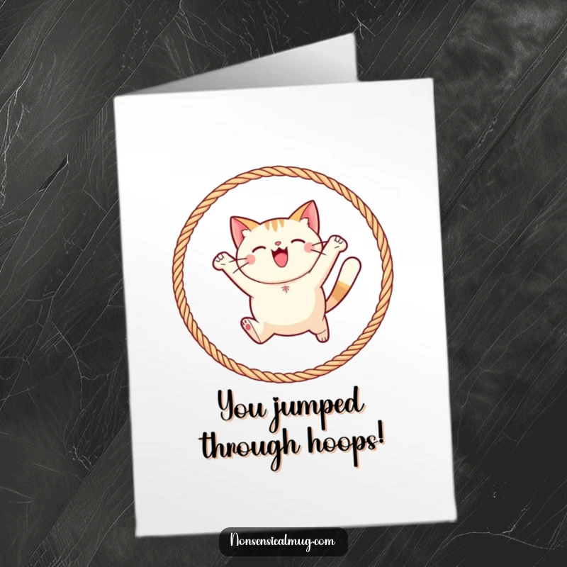 Funny Free Printable Congrats Card: A round cat character exuberantly leaping through a hoop of colorful yarn.