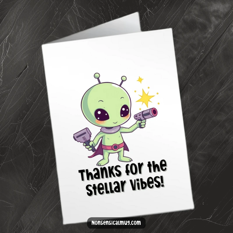 Funny Free Printable thank you card: a friendly kawaii alien fires a sparkly ray gun, sending thanks across the galaxy.
