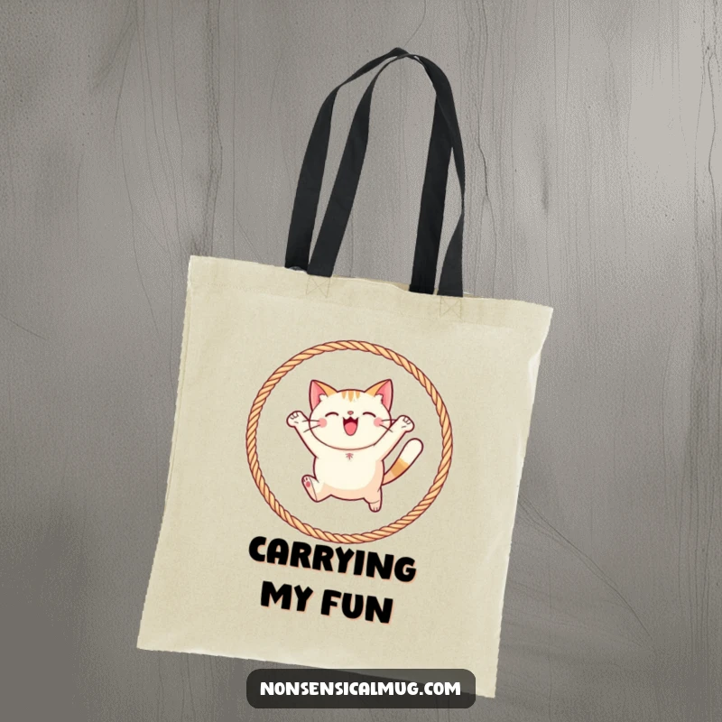 Funny round cat joyfully leaping through a hoop of yarn on a tote bag, ideal for carrying items with a touch of feline fun.