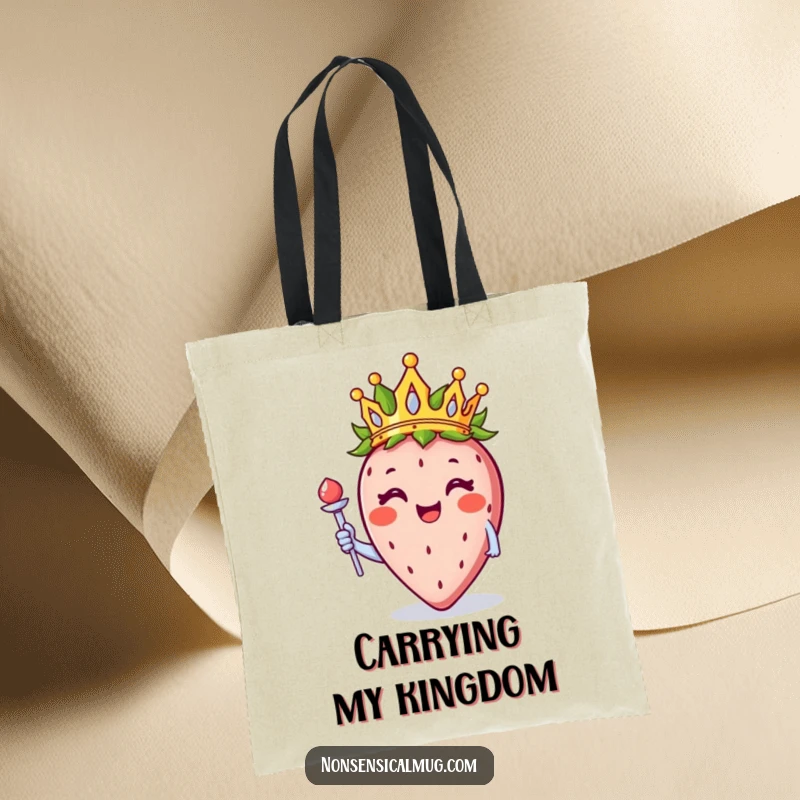 Funny strawberry wearing a crown and holding a tiny scepter, illustrated on a stylish and humorous tote bag.